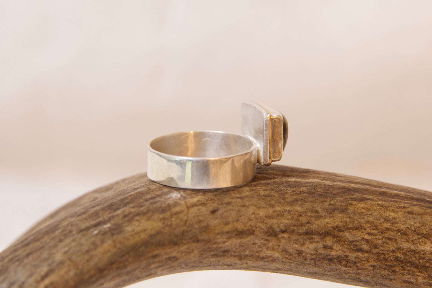 Side profile of shiny sterling silver handmade jewelry