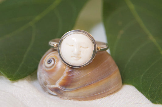 Front of bone carved face ring