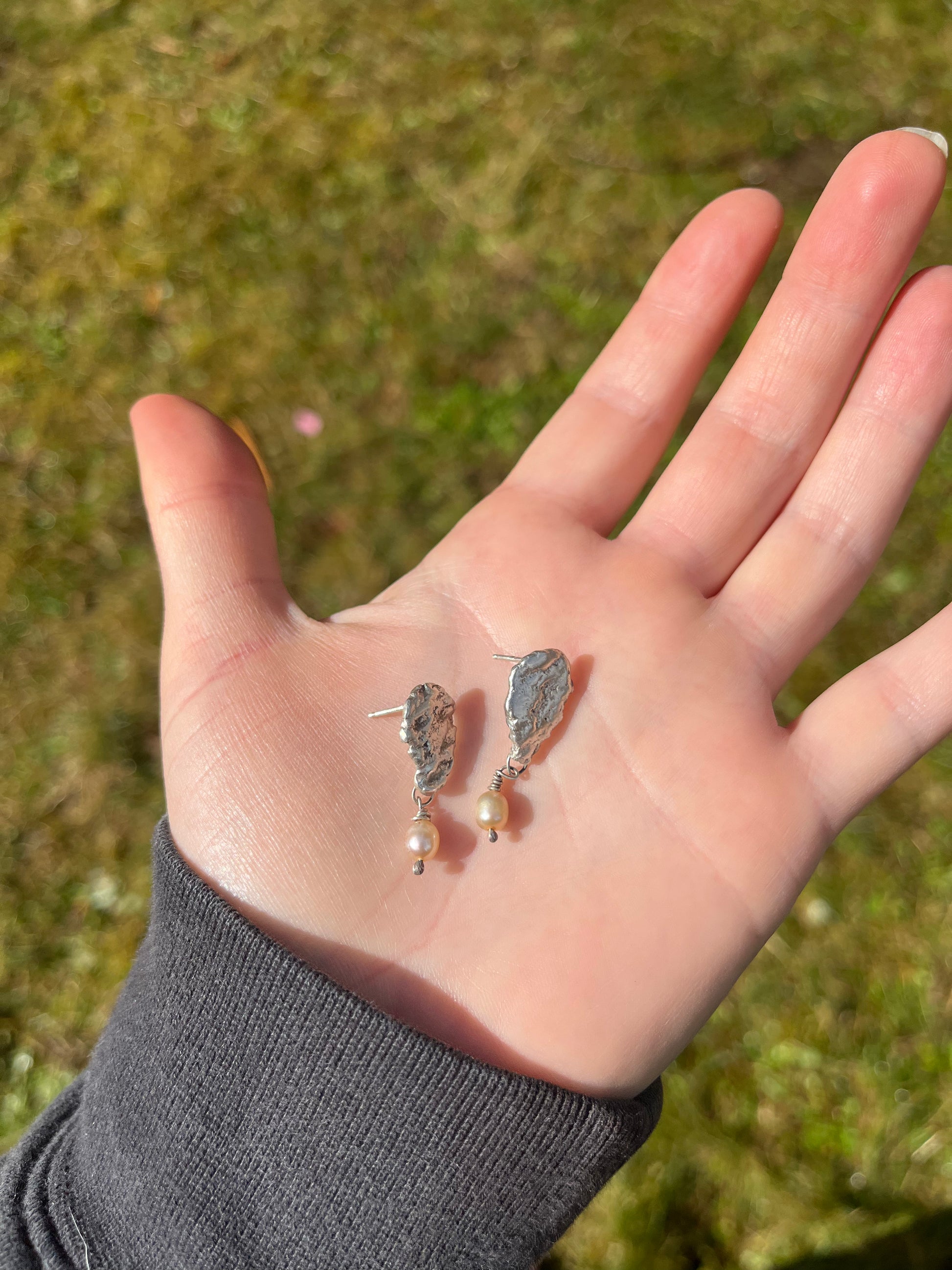Handmade fabricated oyster earrings in sterling silver with freshwater pearls