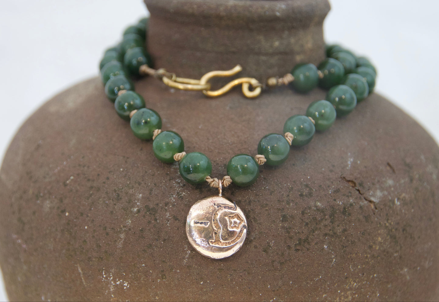 Bronze moon and star pendant on silk with jade beads