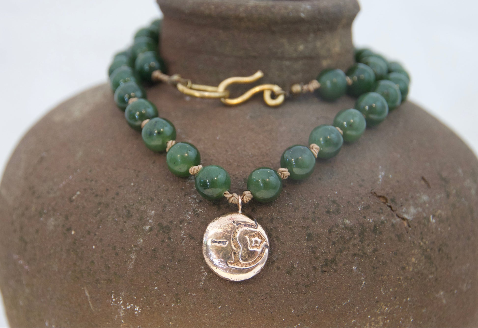 Bronze moon and star pendant on silk with jade beads