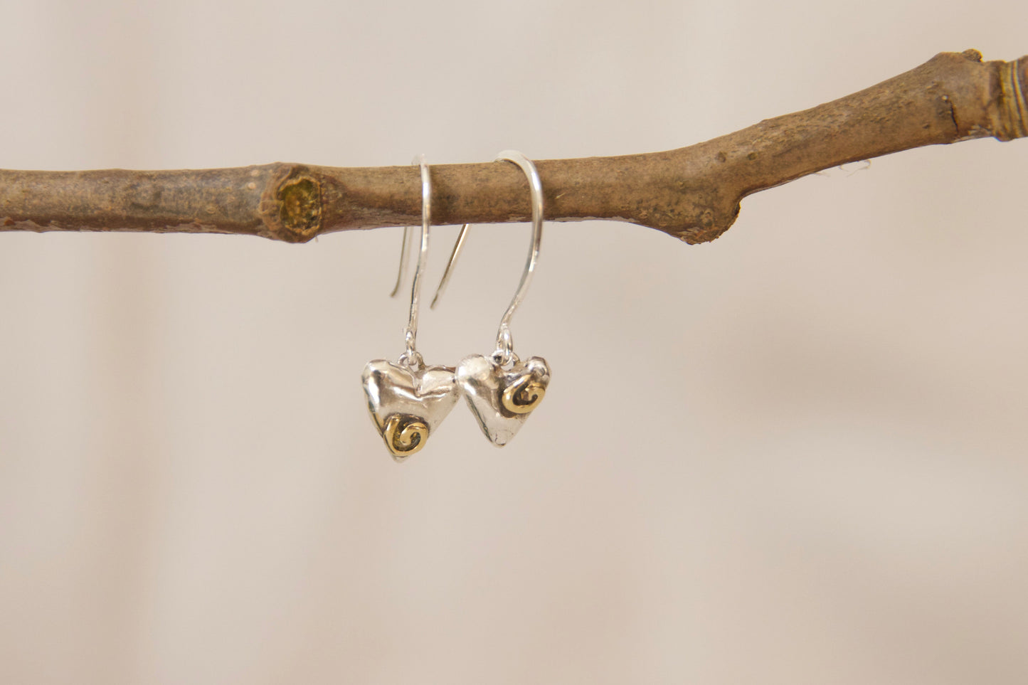 Unique whimsical one of a kind sterling silver and brass heart earrings. Small heart earrings with sterling silver hooks 