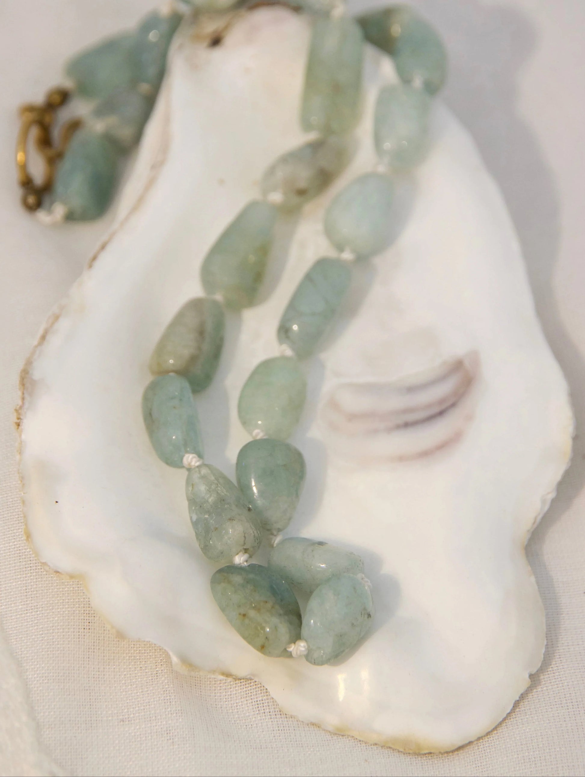 Aquamarine knotted beads on silk string 