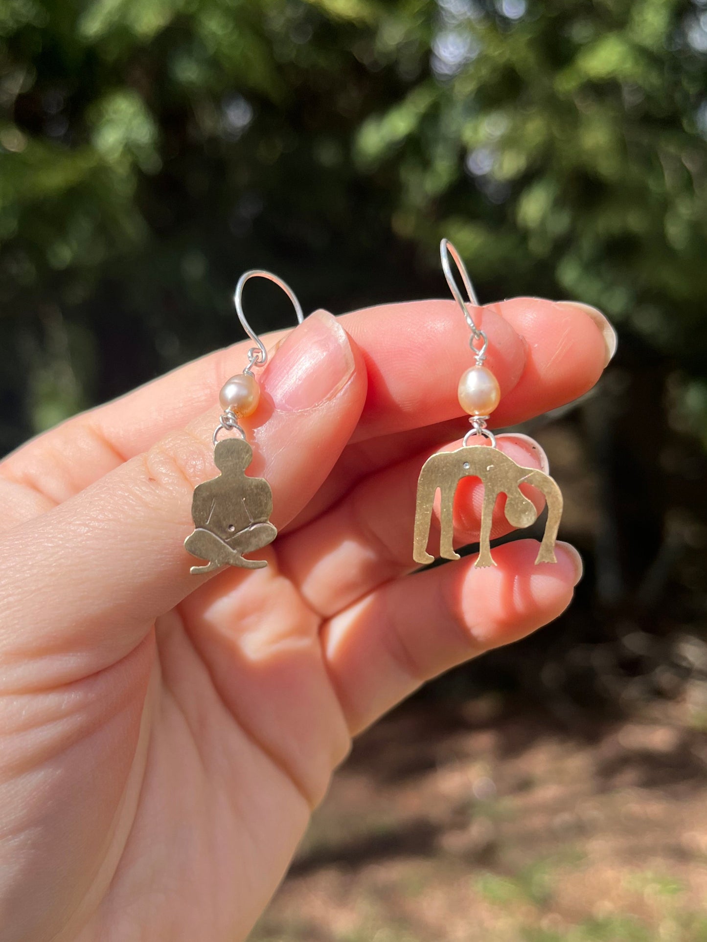 Fun and unique brass earrings in the shape of people contemplating and flopping