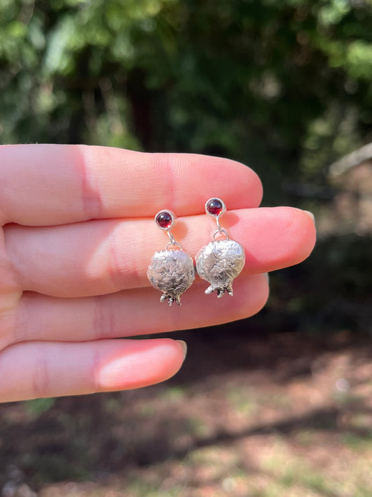 Unique hand fabricated pomegranate earrings. vibrantly set garnets in sterling silver 