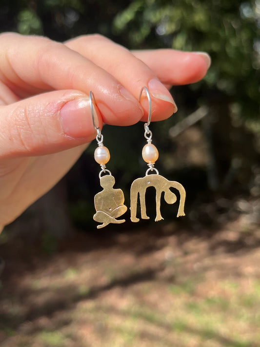 Unique handmade brass people artfully cut out in brass with pearl beads and sterling silver hooks. One of a kind jewelry handmade 