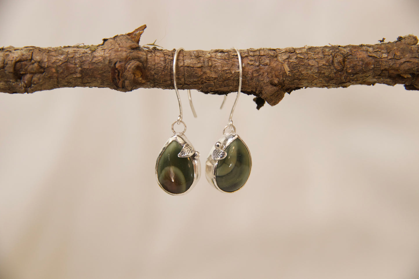 Beautifully intricate leaf cut out in sterling silver set around imperial jasper stone