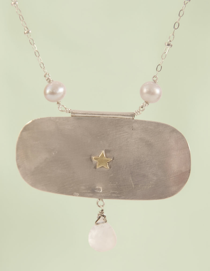Necklace with star on back 