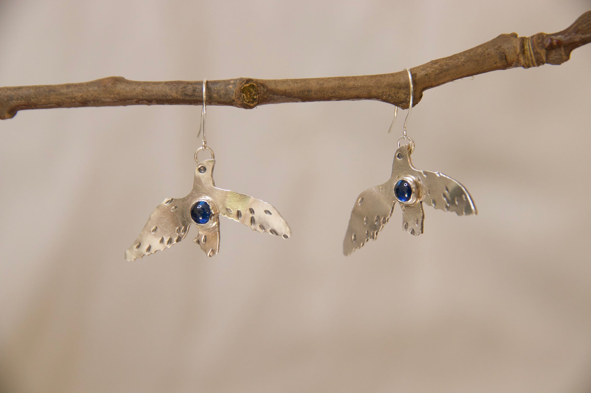 Unique one of a kind Sapphire bluebird earrings. Hand crafted in sterling silver bright blue stones