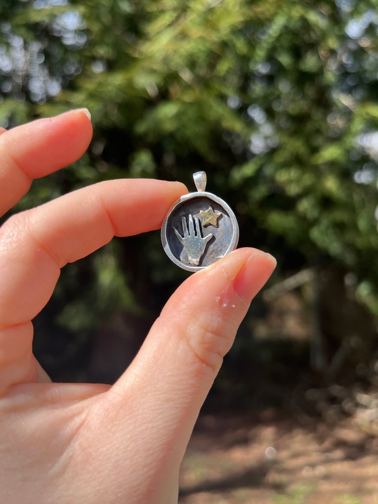 Unique sterling silver hand reaching for star